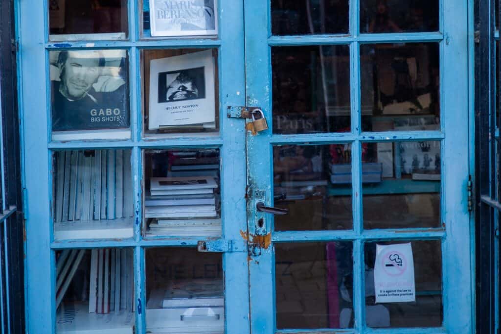 Books through the glass door of a bookstore